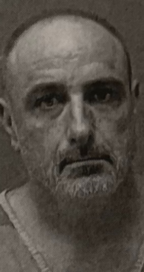 screenshot 2025 07 22 at 10.52.54 pm Black and white portrait of a man.