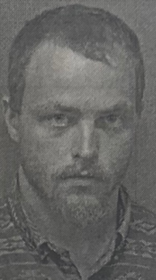 screenshot 2025 07 22 at 2.11.45 pm Grayscale photo of a man with short hair.