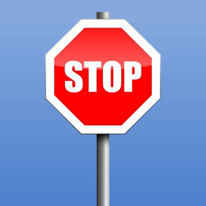 Red stop sign on blue background.