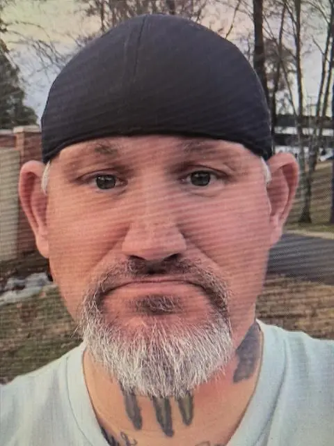 image 2026 02 10 091904003 Man with beard and tattoos wearing a black cap.